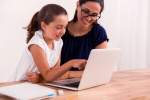 parent and student working on computer