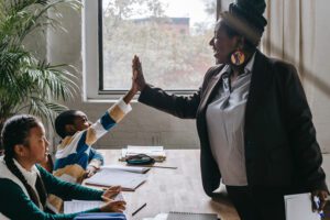 teacher high-fiving student