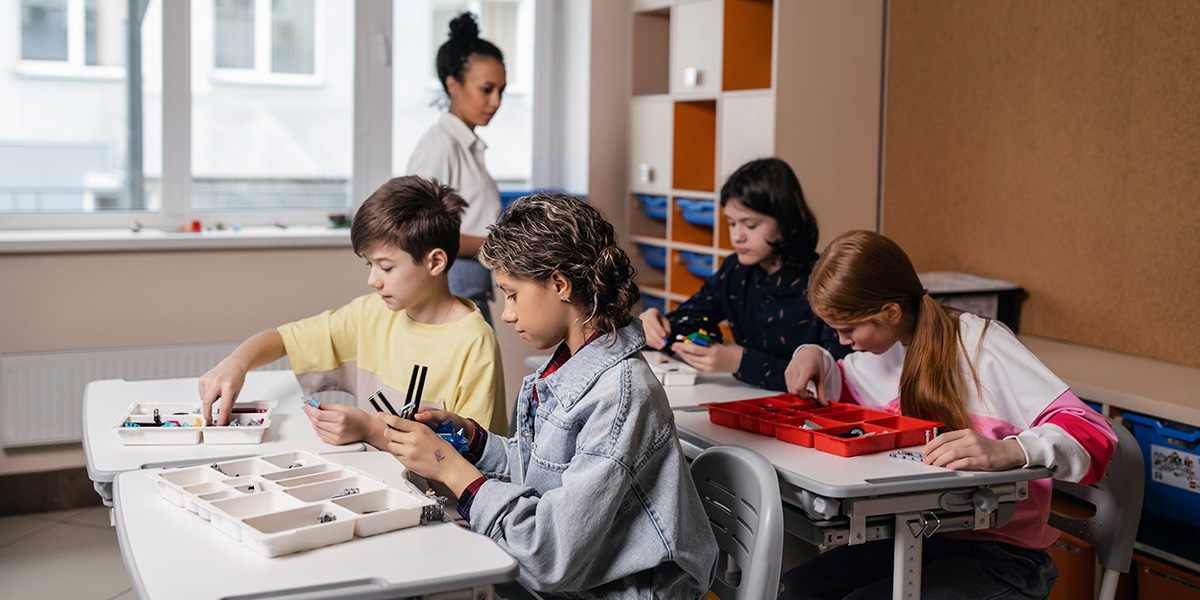 students working with teacher