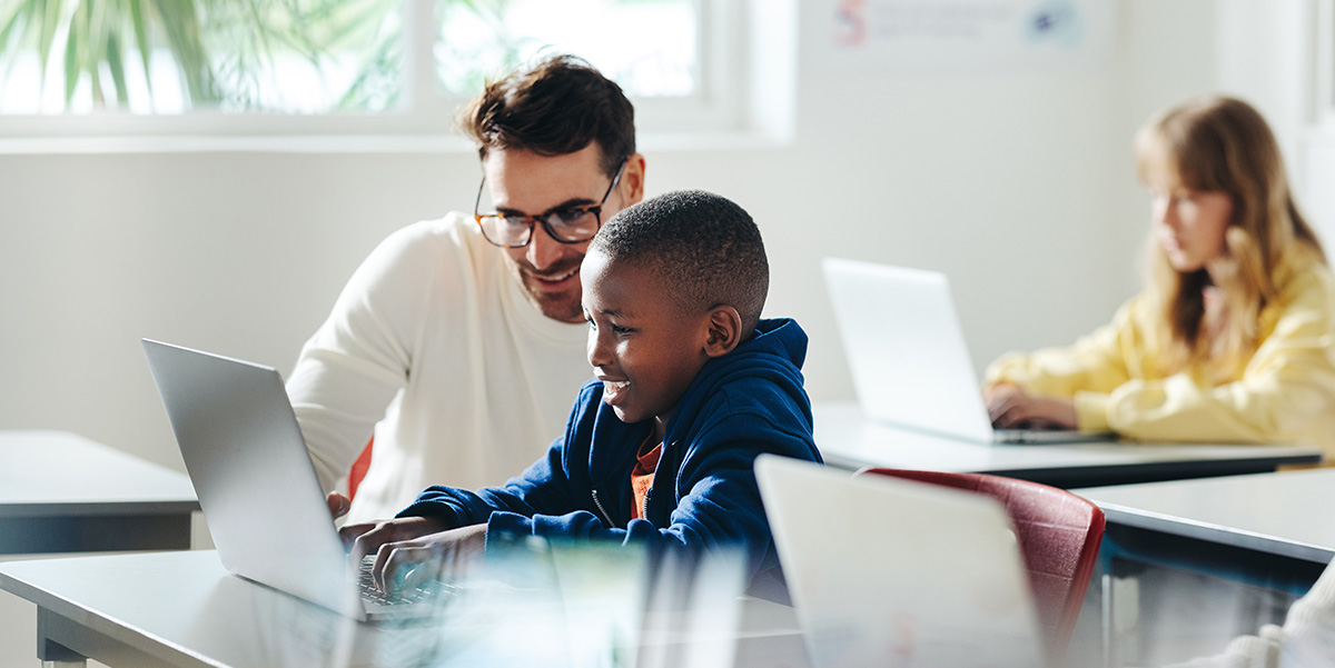 teacher helping student