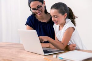 mom and daughter on computer