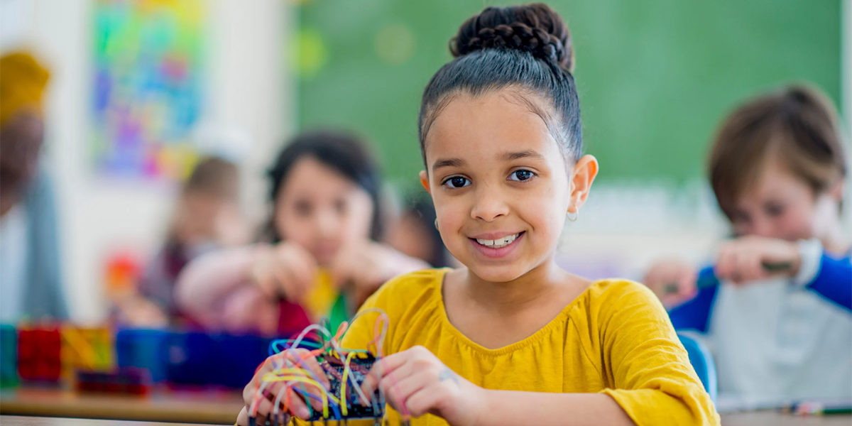 girl working in STEM class