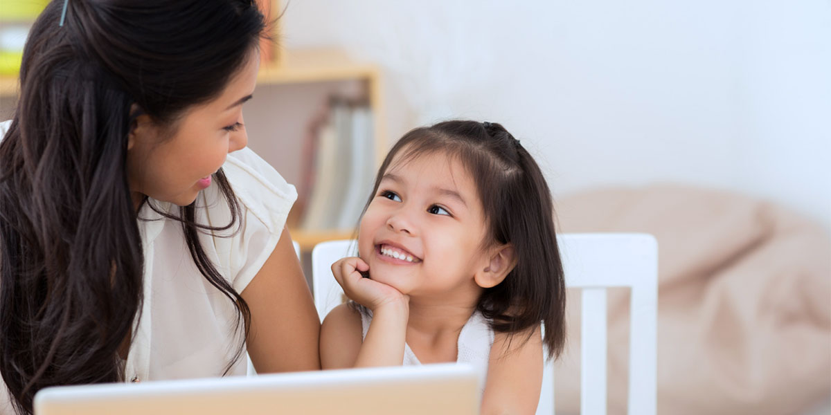 mother and daughter completing online enrollment